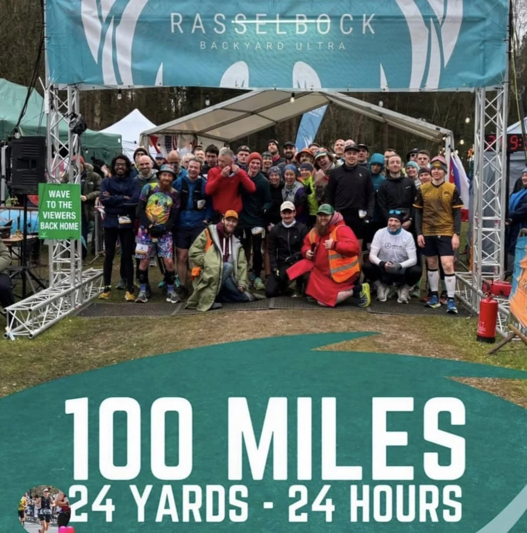 Group photo at a 100-mile running event shared for Paul’s story